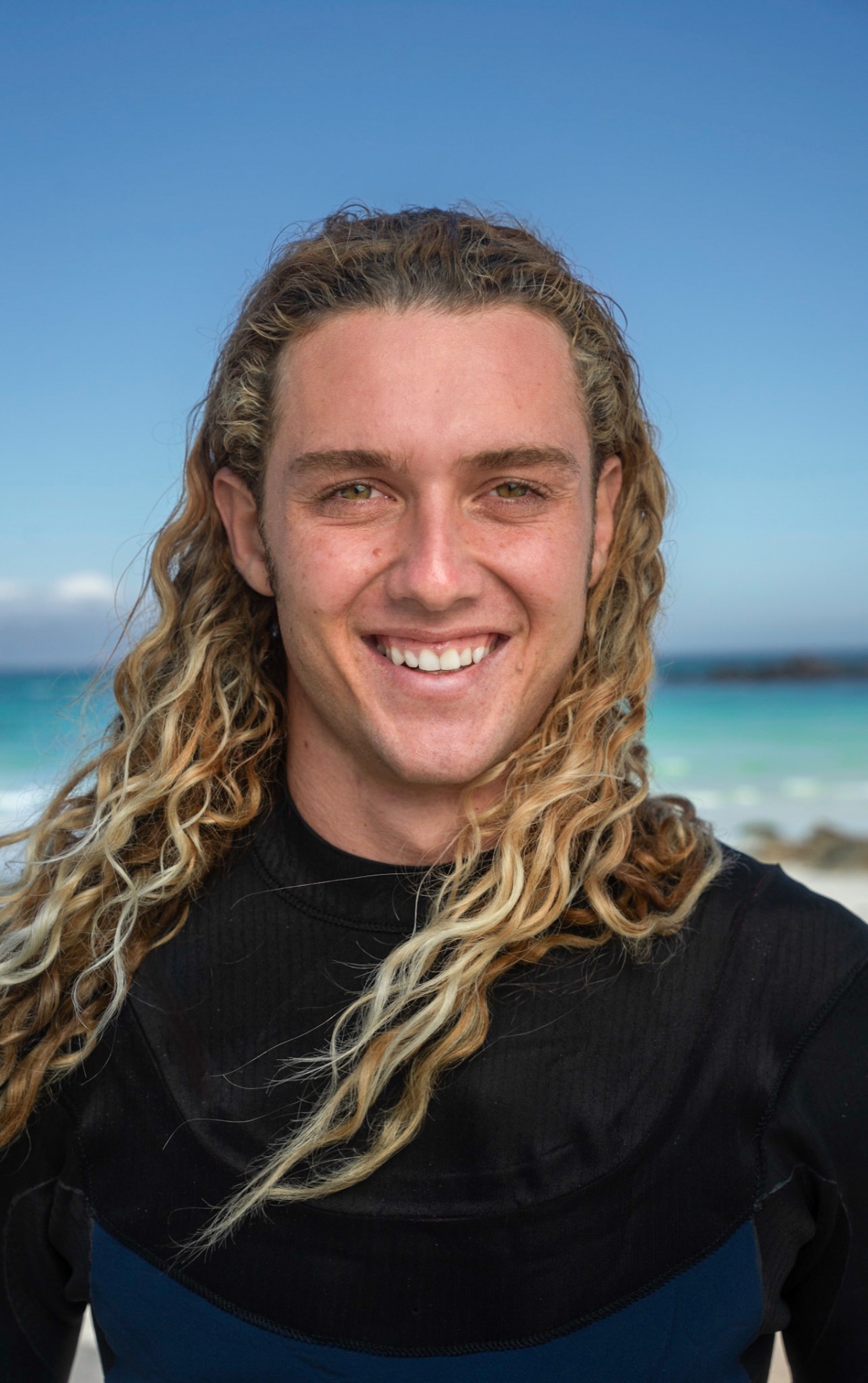 Yücel Paralik smiling on the beach in Cyprus